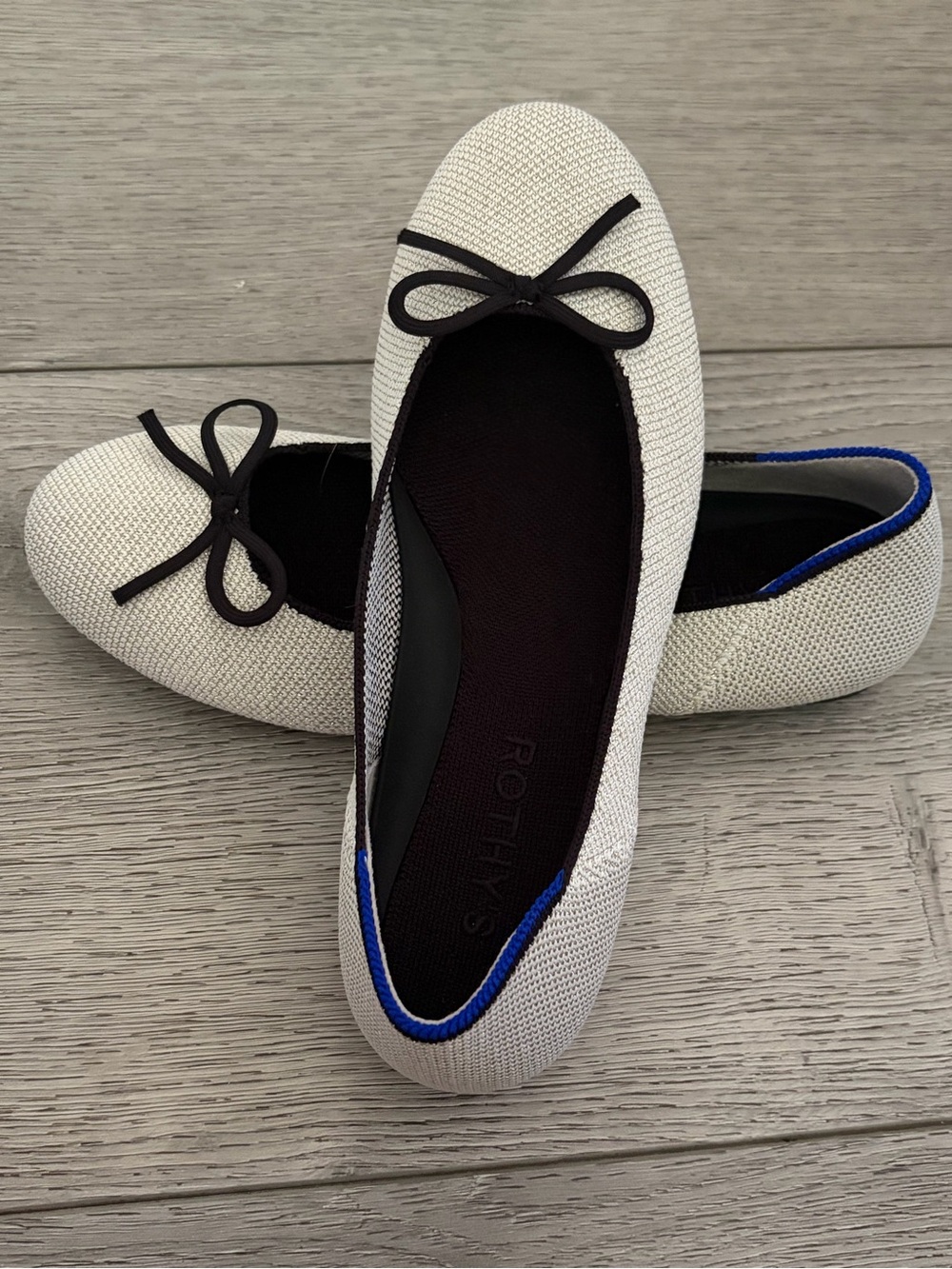 Rothy's Cream Knit Ballet Flats with Black Trim and Blue Accent